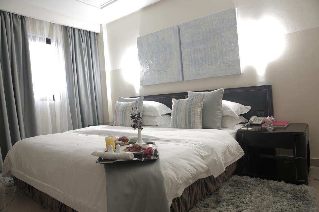 Oak Plaza Hotels East Airport Acra Quarto foto